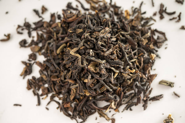 A close up picture of vibrant Darjeeling Tea Leaves by Red Moon Tea.