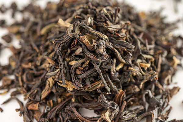 A zoomed in picture of vibrant Darjeeling Tea Leaves by Red Moon Tea.
