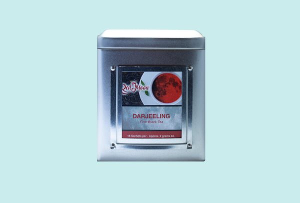 A picture of a Silver Tin Canister of Darjeeling Fine Black Tea from Red Moon Tea.