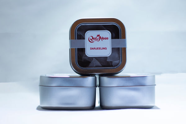 A picture of Silver To Go Tin Canister of Darjeeling Tea in pyramid satchels from Red Moon Tea.