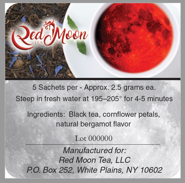 A picture of the description on the back of a Silver To Go Tin of Earl Grey Tea from Red Moon Tea.