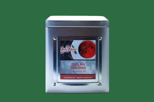A picture of Silver To Go Tin Canister of Oolong Tea in pyramid satchels from Red Moon Tea.
